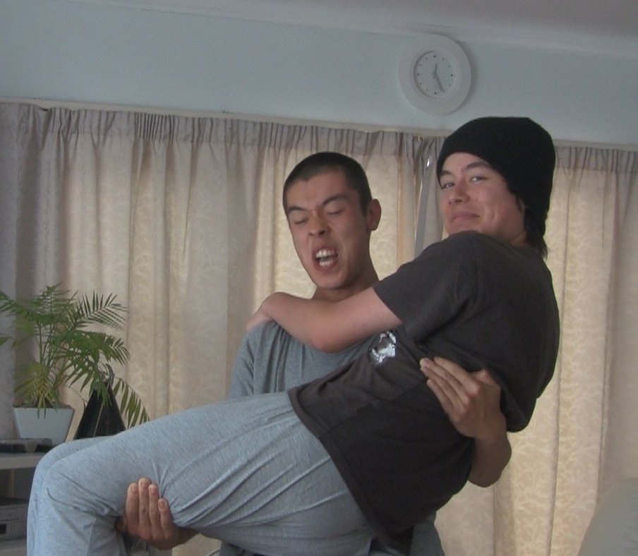 Still image from video where I hold my brother for as long as I can